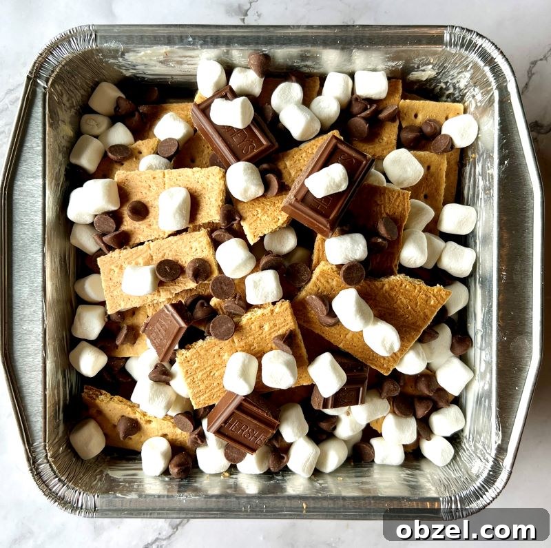 S'mores Nachos Recipe for Grill, Campfire, or Oven 5 Layered s'mores in pan