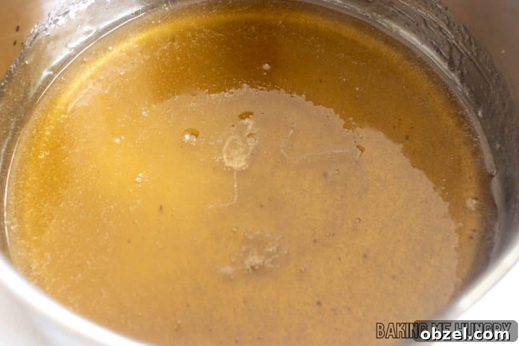 Old Fashioned Pecan Brittle Recipe 7 caramel mixture in saucepan