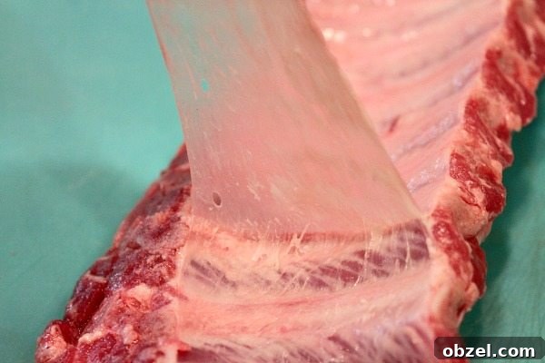 Juicy Slow Cooker Baby Back Ribs Recipe 5 removing silverskin from ribs