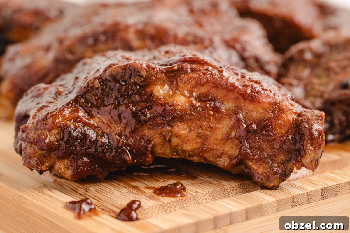 Juicy Slow Cooker Baby Back Ribs Recipe 9 close up baby back rib