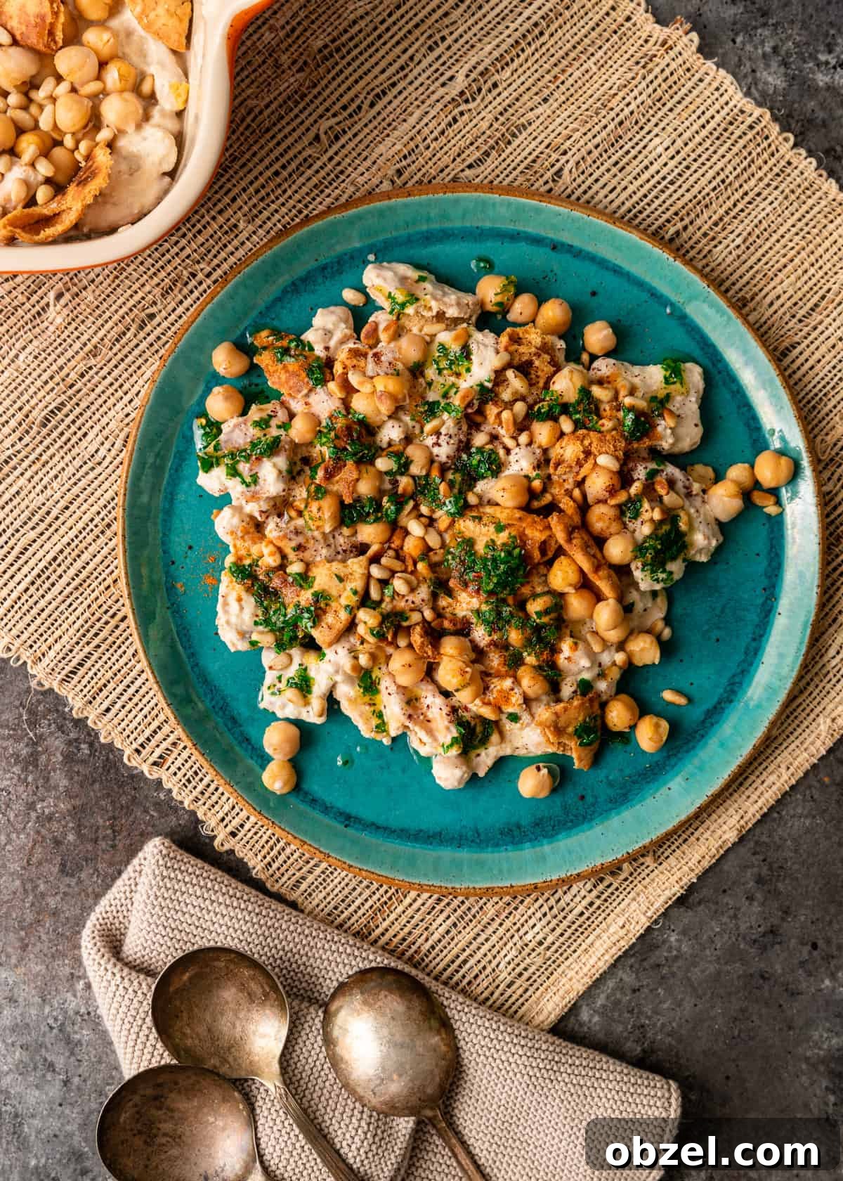 Fatteh with Crispy Pita Hummus and Yogurt 12 overhead: fatteh spread on plate