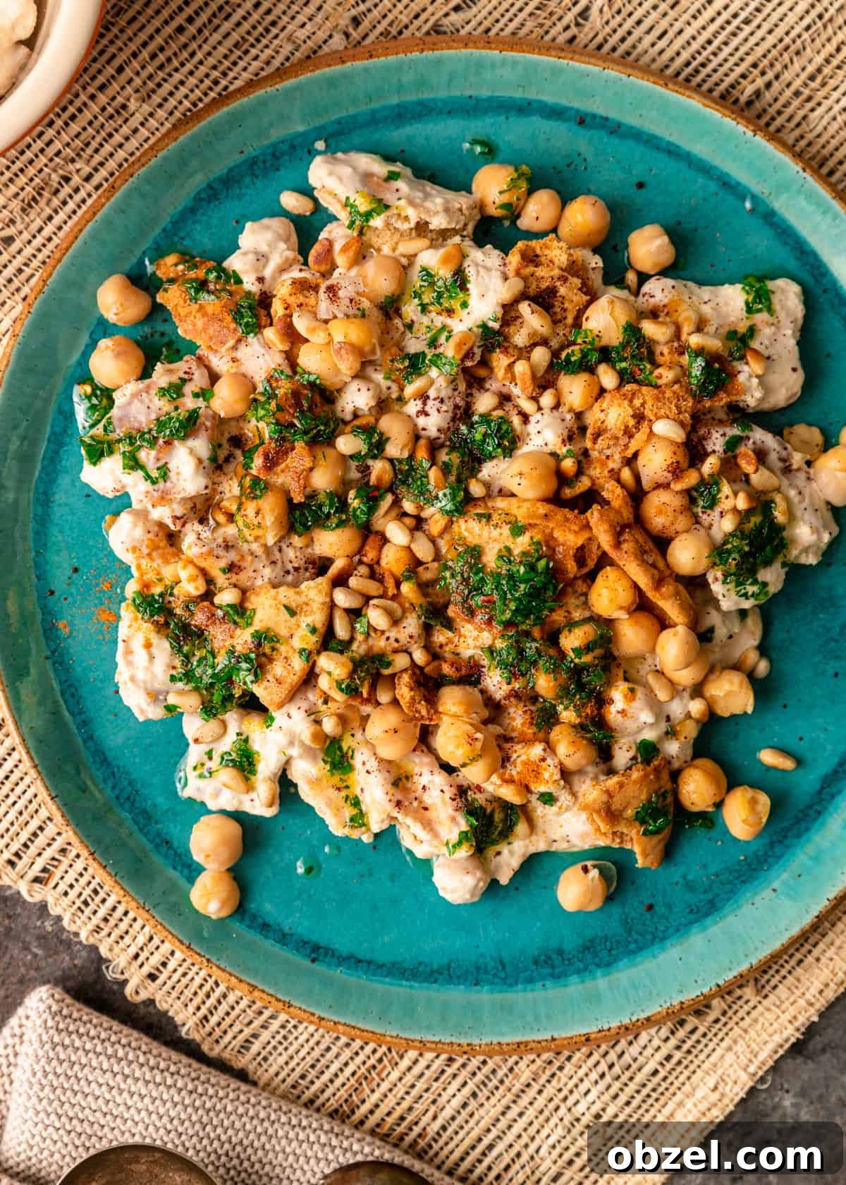 Fatteh with Crispy Pita Hummus and Yogurt 4 overhead: fattet hummus on blue plate
