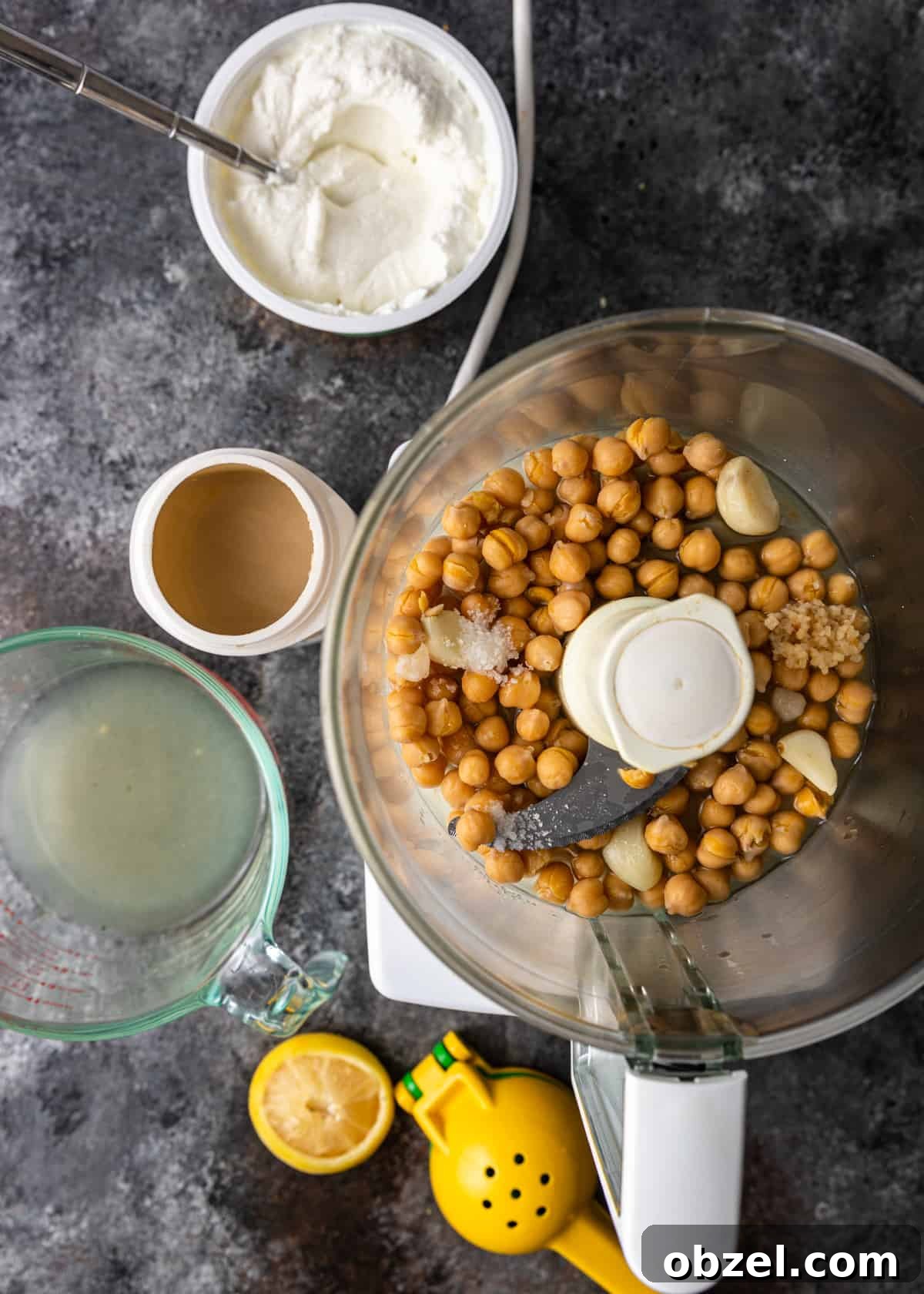 Fatteh with Crispy Pita Hummus and Yogurt 7 overhead process shot: chickpeas in food processor bowl for fatteh recipe