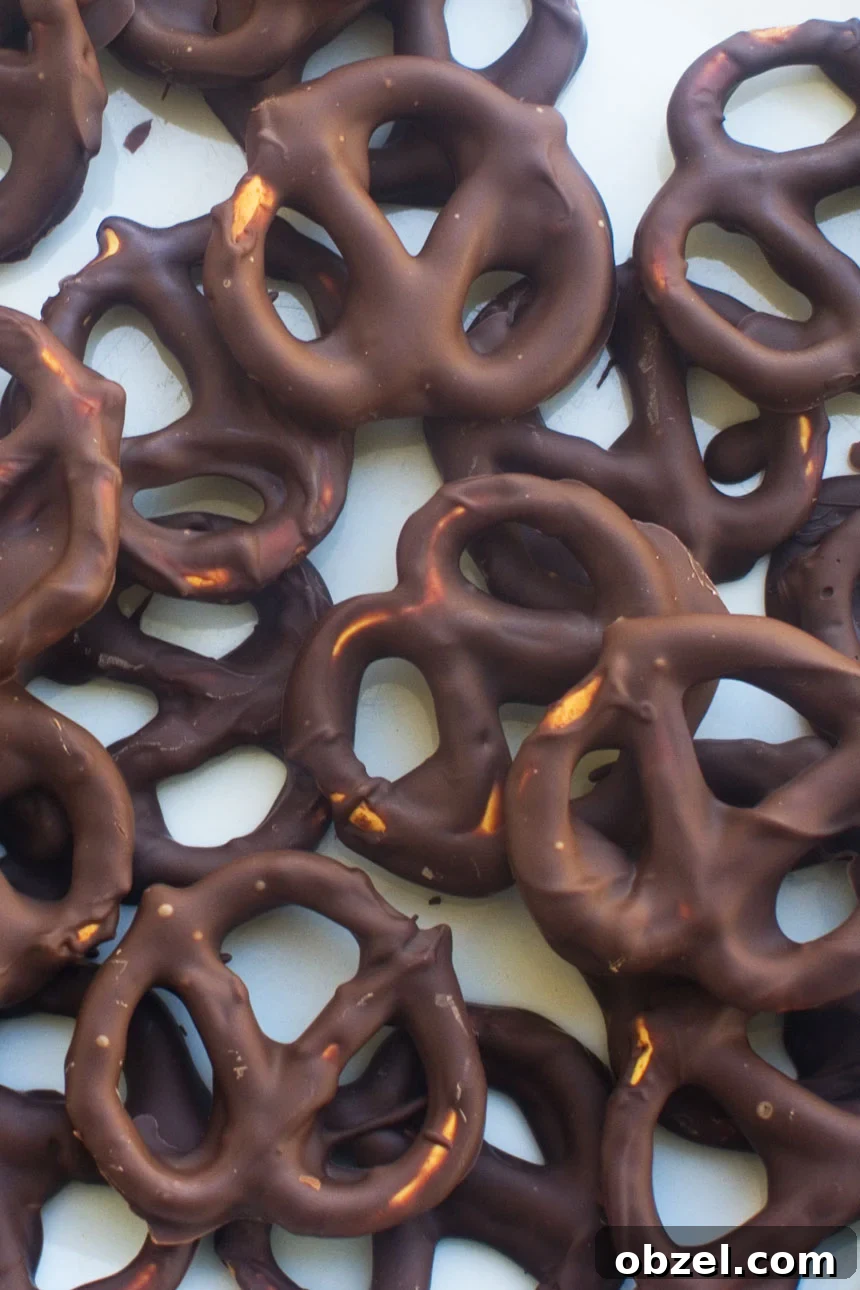 Chocolate Covered Pretzels in 10 Minutes 4 Chocolate covered pretzels on a lined baking tray
