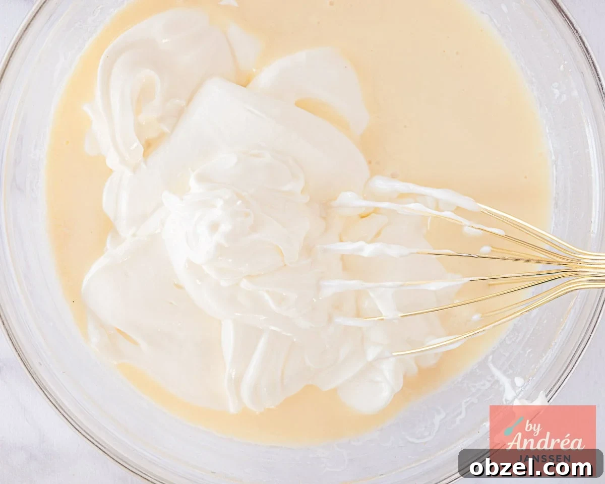Homemade Berry Frozen Yogurt 5 Whisk the Greek yogurt into the condensed milk mixture.