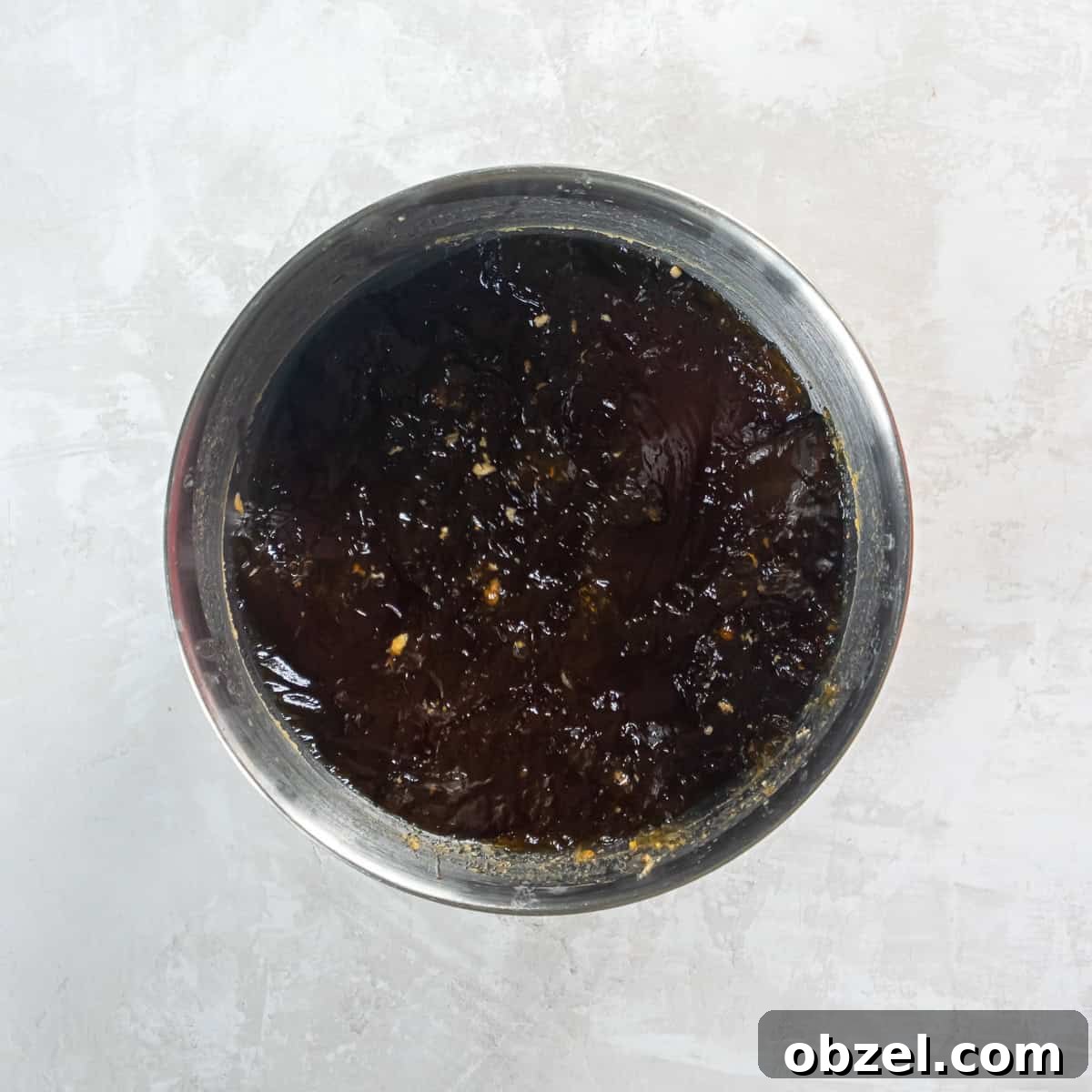 Slow Cooker Pulled Pork Recipe 11 Defatted cooking liquid in a bowl.