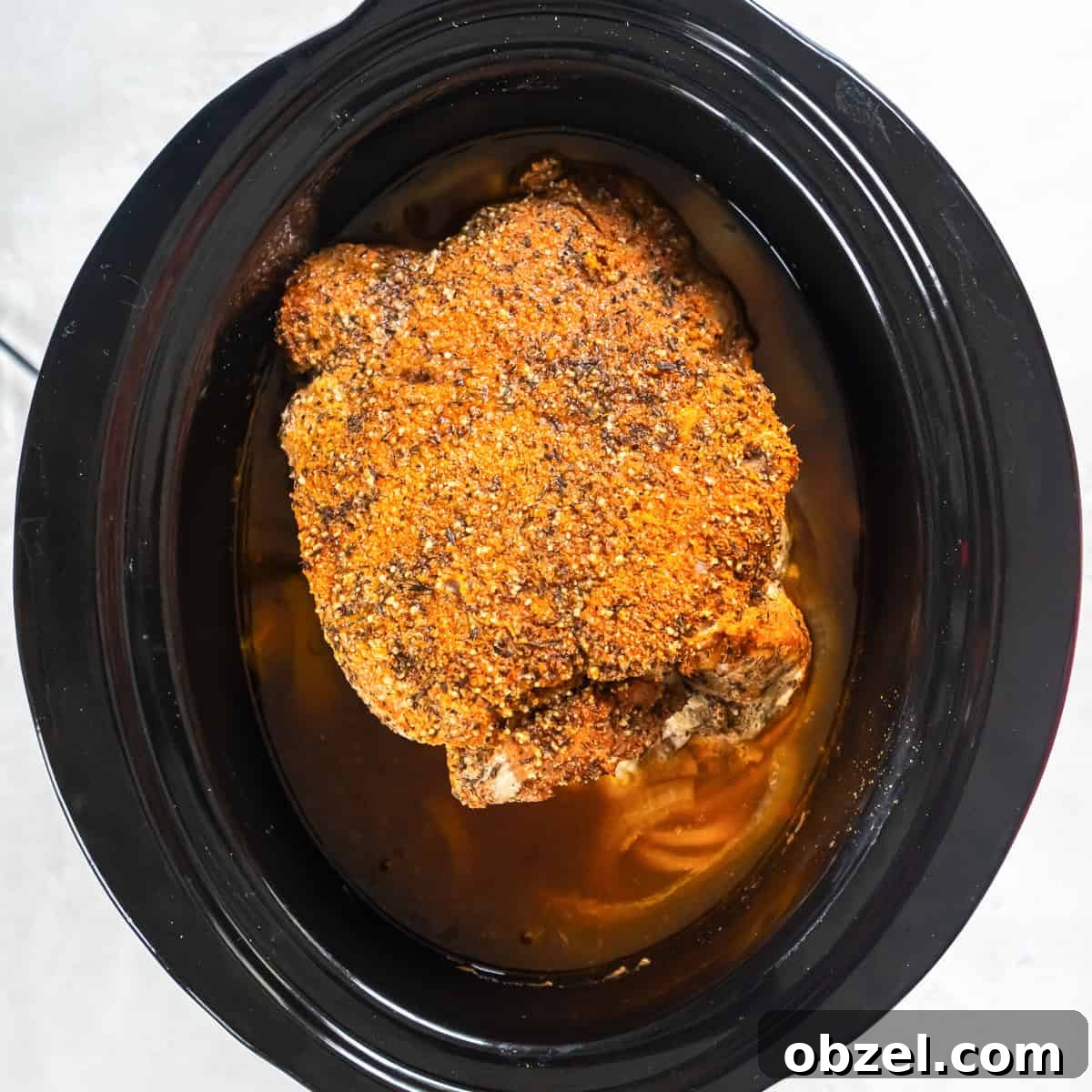 Slow Cooker Pulled Pork Recipe 8 Cooked pork shoulder in a slow cooker after cooking, ready to shred.