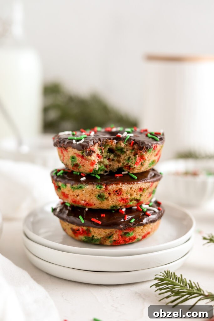 Festive Christmas Donuts for Holiday Baking 2 Baked Christmas donuts with chocolate ganache and festive sprinkles
