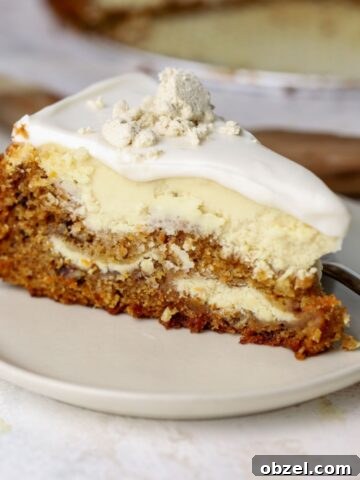 A slice of carrot cheesecake with topping on a plate