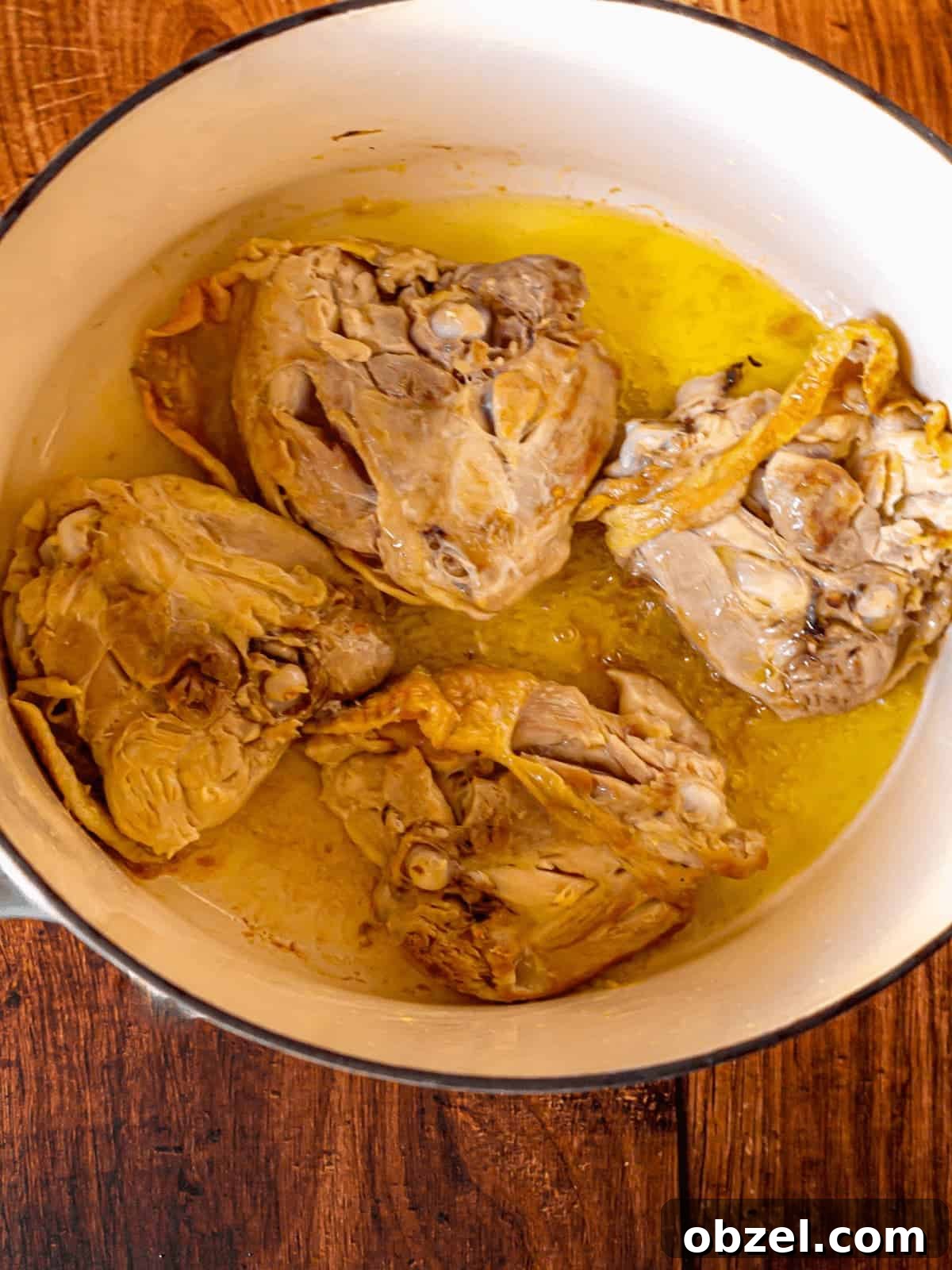 Homemade Bone-In Chicken Soup Recipe with Rich Broth 4 Browned chicken thighs in oil in a Dutch oven.