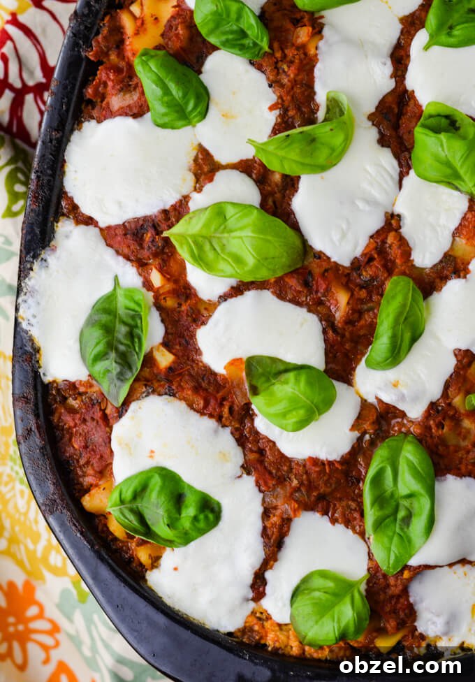 Crock Pot Lasagna Recipe with Meat Sauce 2 Cooked crock pot lasagna topped with fresh mozzarella and basil.