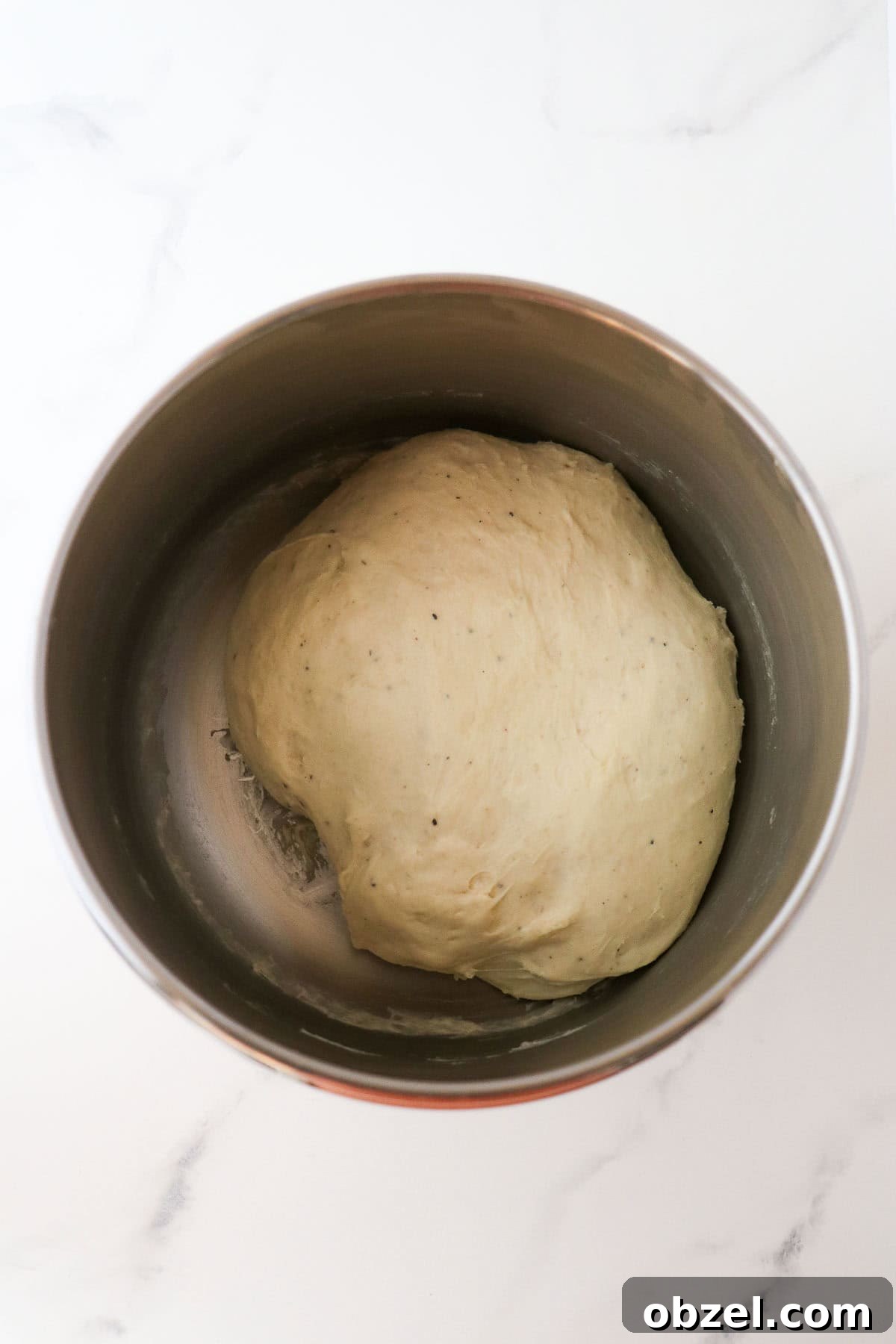Fastelavnsboller: Norwegian Lenten Buns Recipe 6 Risen dough for Fastelavnsboller (Norwegian Lenten Buns) in a metal bowl.