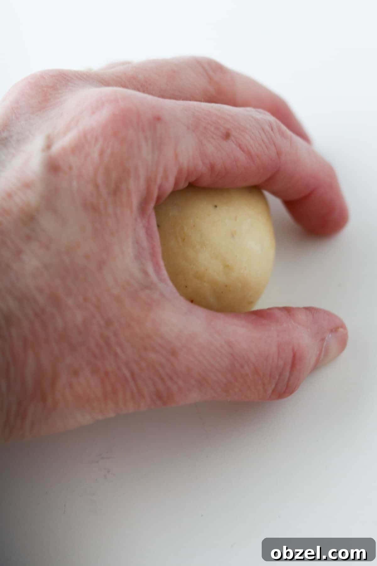 Fastelavnsboller: Norwegian Lenten Buns Recipe 7 Person shaping a Norwegian Lenten Bun.