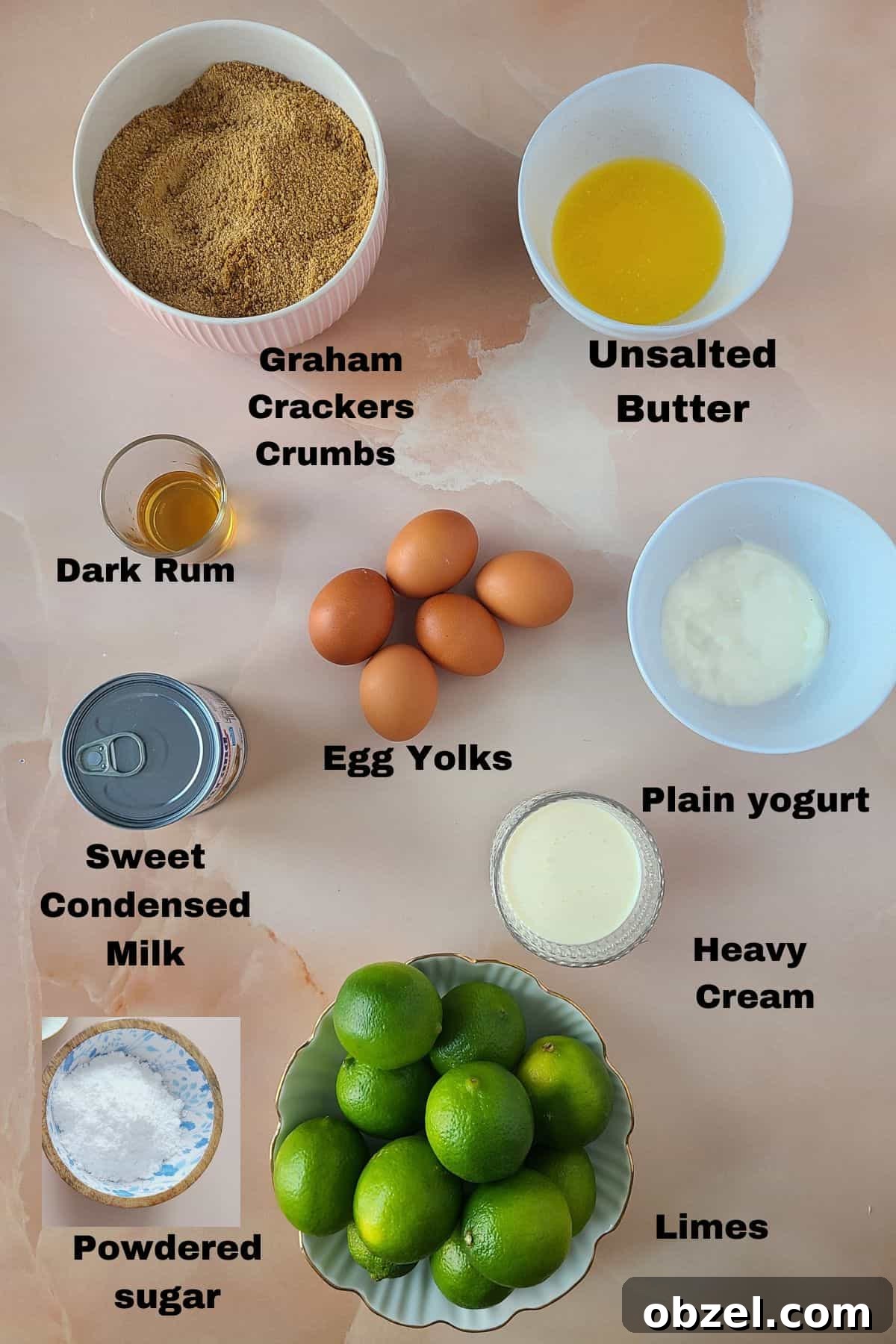 Key Lime Pie Recipe with Graham Cracker Crust 4 Key lime pie ingredients showcased on beautiful pink marble background