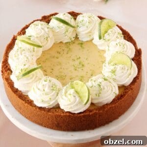 Key Lime Pie Recipe with Graham Cracker Crust 10 Key lime pie beautifully decorated with whipped cream swirls, lime wedges and lime zest.