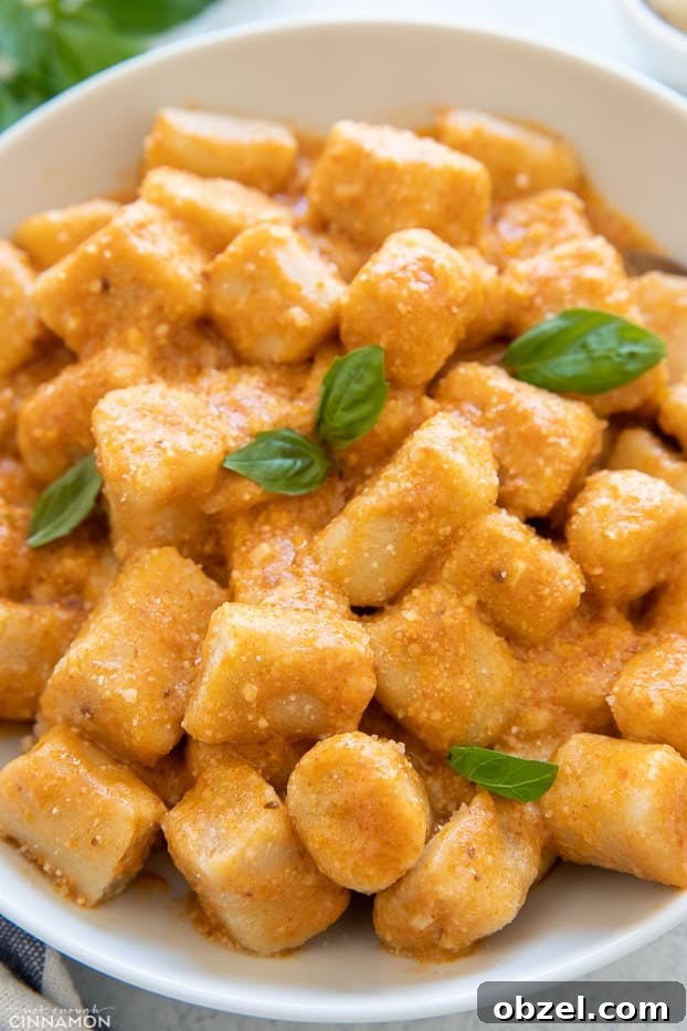 cauliflower gnocchi recipe close-up shot of homemade Trader Joes Cauliflower gnocchi tossed with sun-dried tomato paste