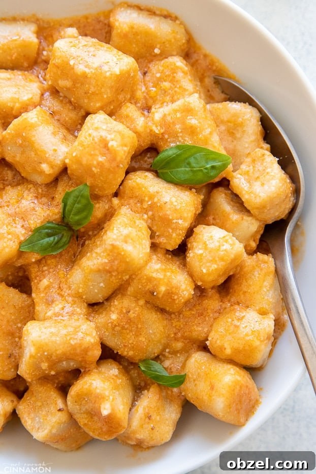 Trader Joes Copycat Cauliflower Gnocchi Recipe 3 overhead shot of homemade cauliflower gnocchi tossed with sun-dried tomato sauce