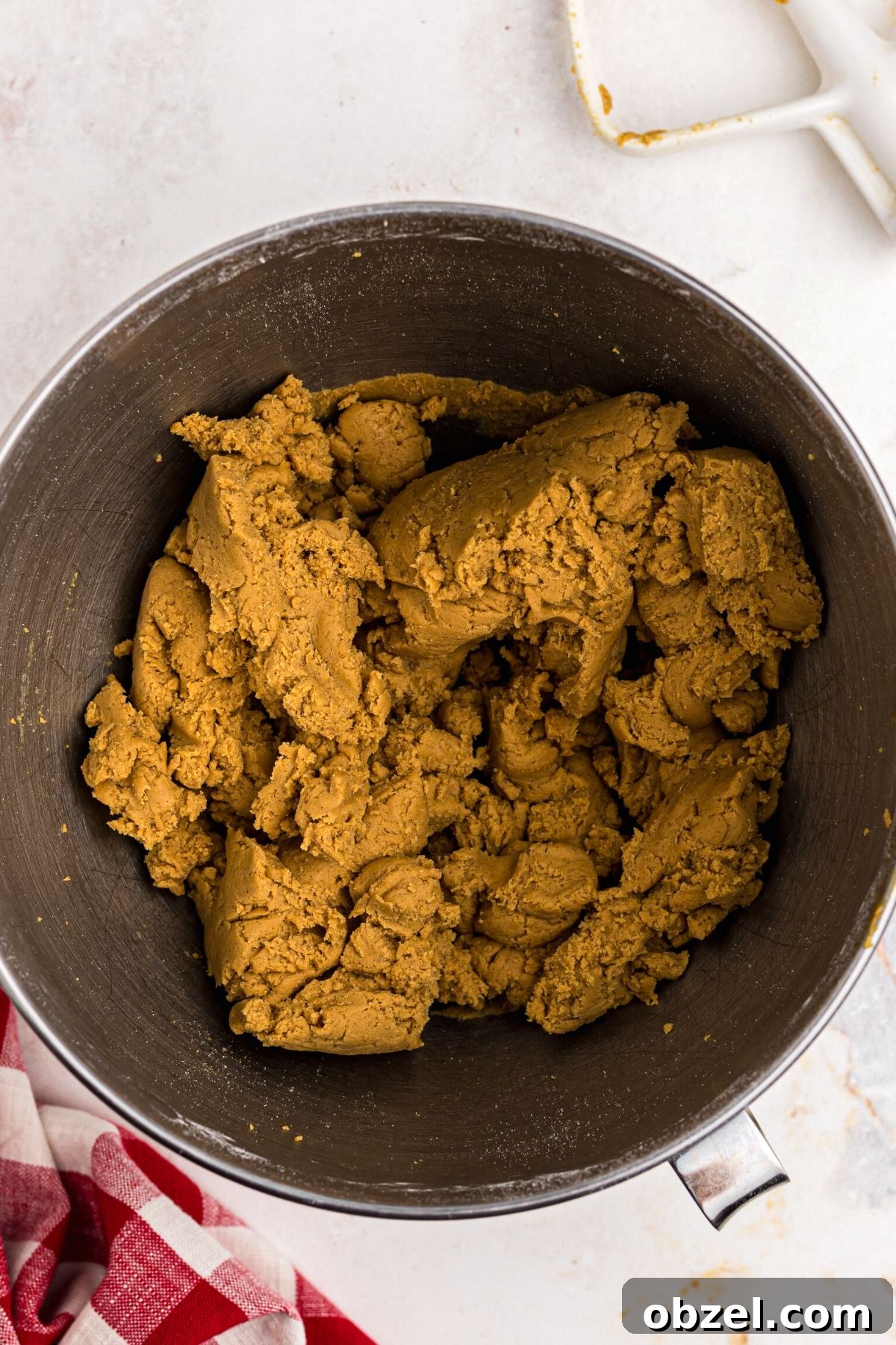 Air Fryer Gingerbread Cookies Recipe 7 Golden brown gingerbread dough in a kitchen aid bowl