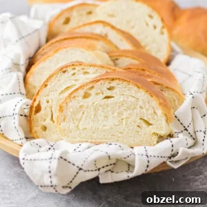 Homemade Italian Bread Recipe with Crispy Crust 3 A sliced loaf of Italian bread in a basket.