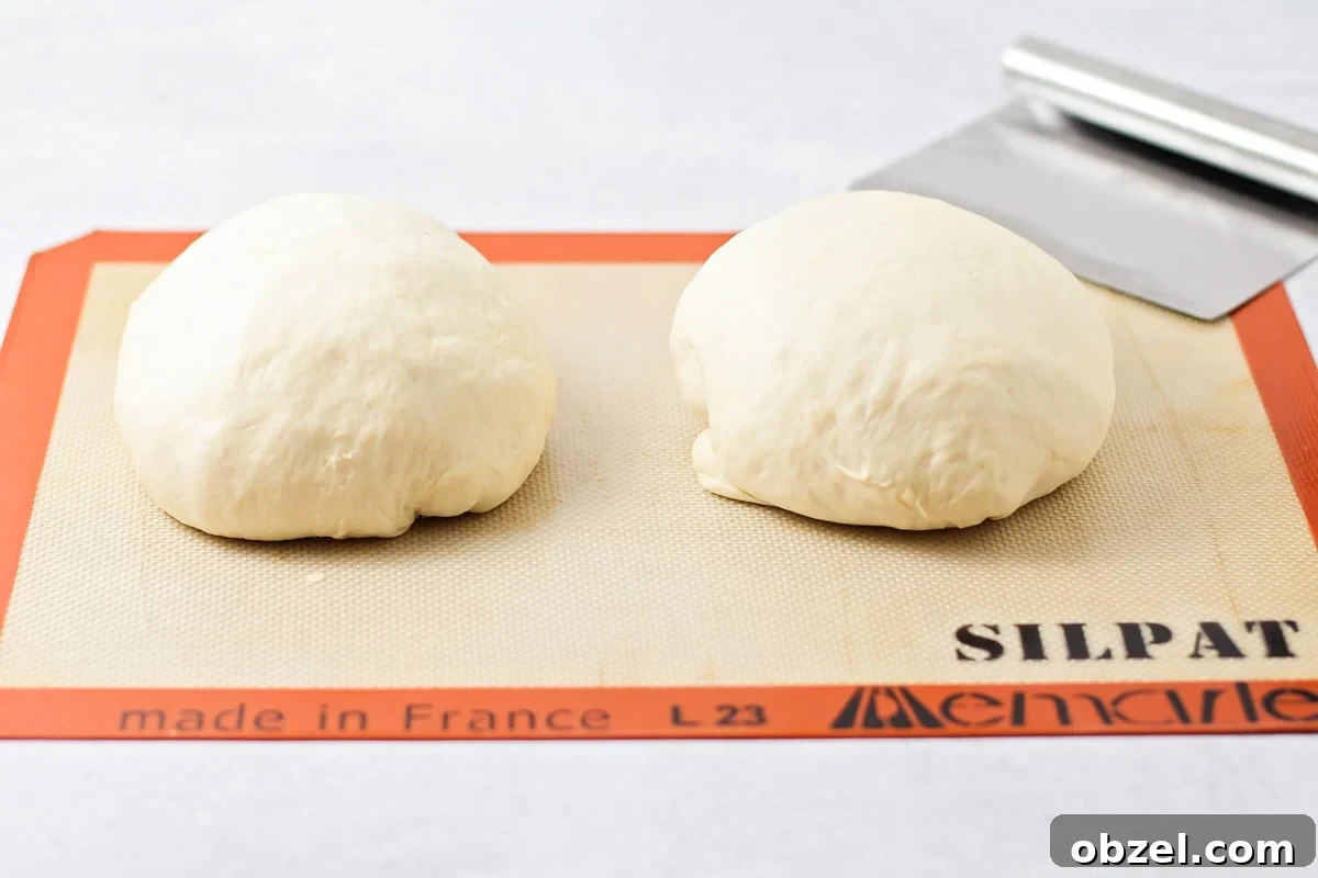 Preparing Italian bread loaves for baking. Cutting, rolling, and prepping Italian loaves for baking.