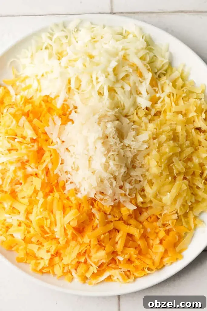 easy baked mac and cheese assorted shredded cheeses on a plate for homemade mac and cheese