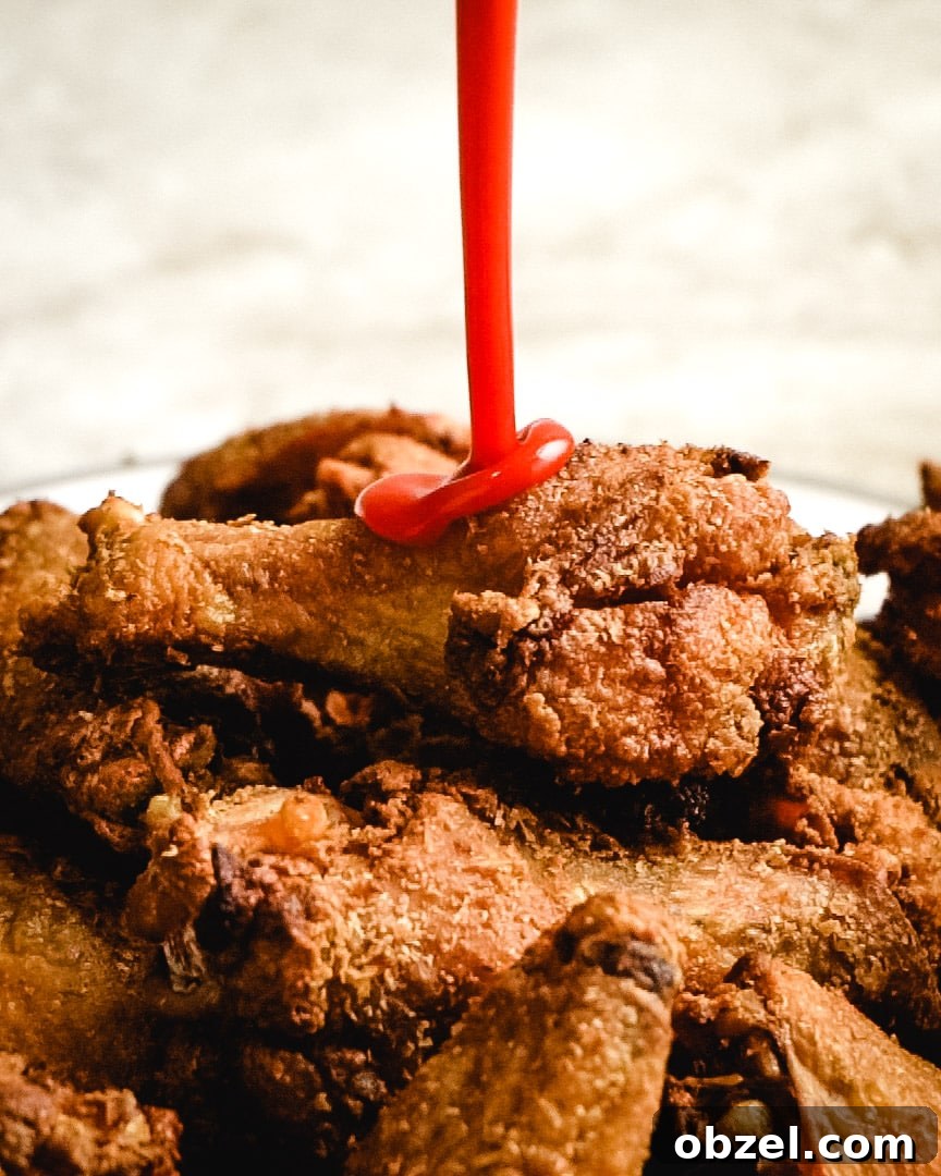 Preparing Crispy Baked Chicken Wings Chicken wings prepared for baking on a rack