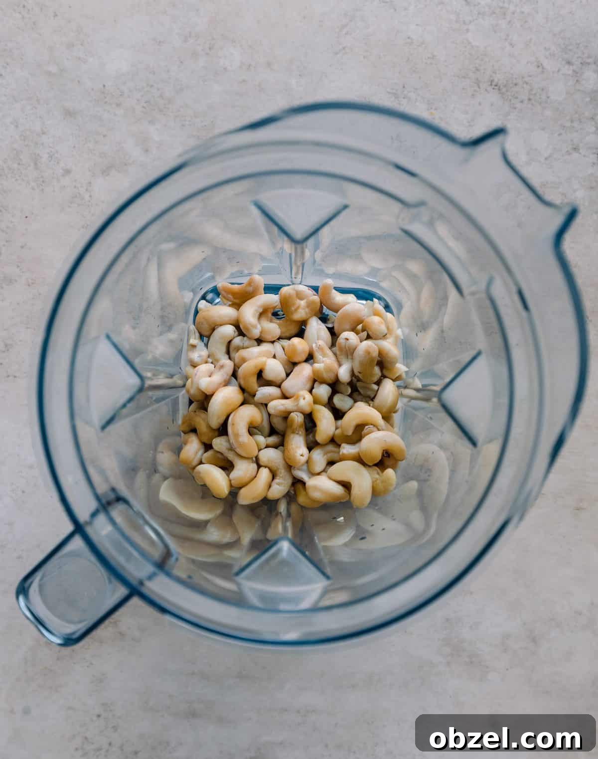 Creamy Vegan Queso Dip 5 soaked cashews in a blender.