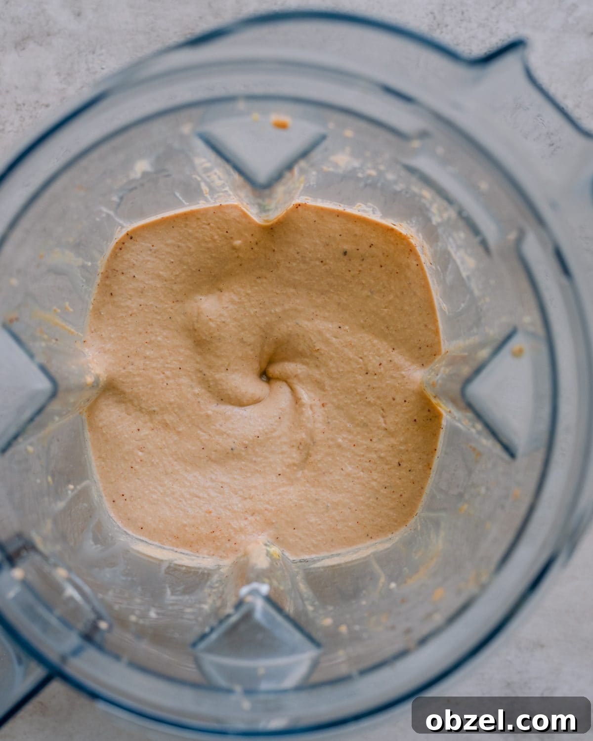 Creamy Vegan Queso Dip 9 fully blended vegan queso in blender.
