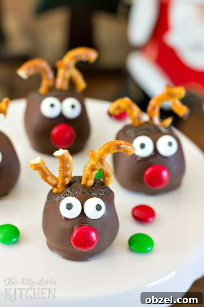 Rudolph Oreo Cookie Balls, fun and festive, made with mint Oreos for an extra holiday twist! from ThisSillyGirlsLife.com #oreocookieballs Rudolph Oreo Cookie Balls, fun and festive, made with mint Oreos for an extra holiday twist! from ThisSillyGirlsLife.com #oreocookieballs