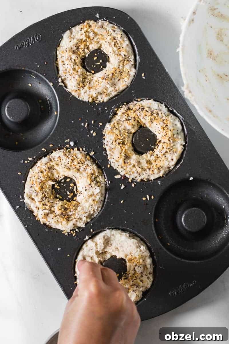 2-Ingredient Gluten-Free Bagels Recipe 6 everything bagel seasoning on top of the pre-baked bagels.