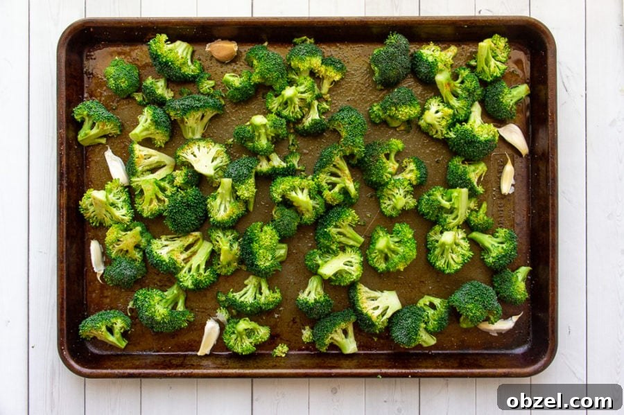 Garlic Roasted Broccoli with Crispy Edges 4 garlic and broccoli on a sheet pan