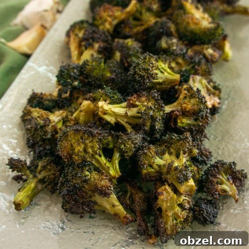 Garlic Roasted Broccoli with Crispy Edges 6 garlic roasted broccoli on a platter