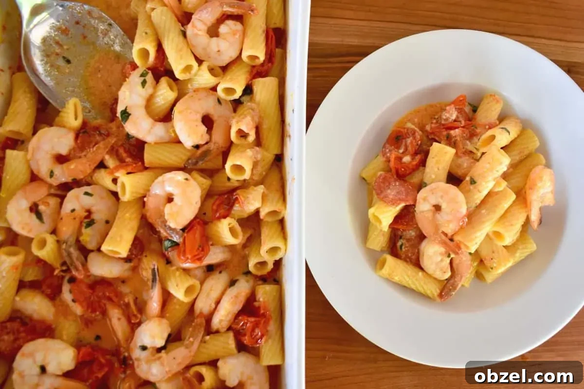 Creamy Baked Feta Pasta with Garlic Shrimp 6 overhead photo of baked feta pasta with shrimp in a large white casserole dish with a white plate of pasta next to it.
