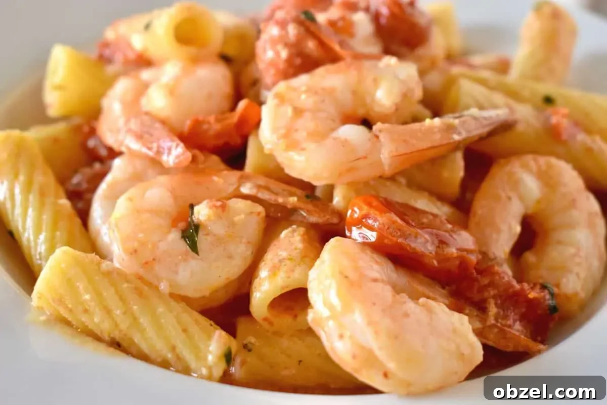 Creamy Baked Feta Pasta with Garlic Shrimp 8 Baked Feta Pasta with Shrimp in a white serving bowl.