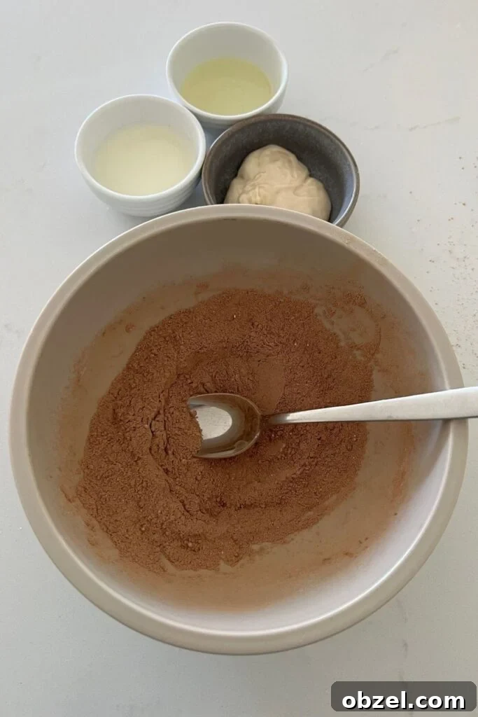 Quick Sourdough Discard Mug Cake Recipe 3 Chocolate sourdough mug cake batter mixed in a small bowl.