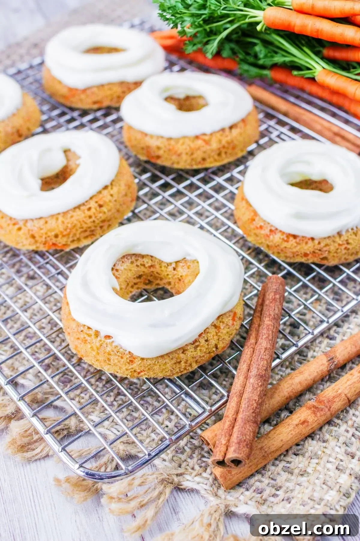 Gluten and Dairy-Free Baked Carrot Cake Donuts 6 A wire rack with a few gluten free carrot cake donuts.