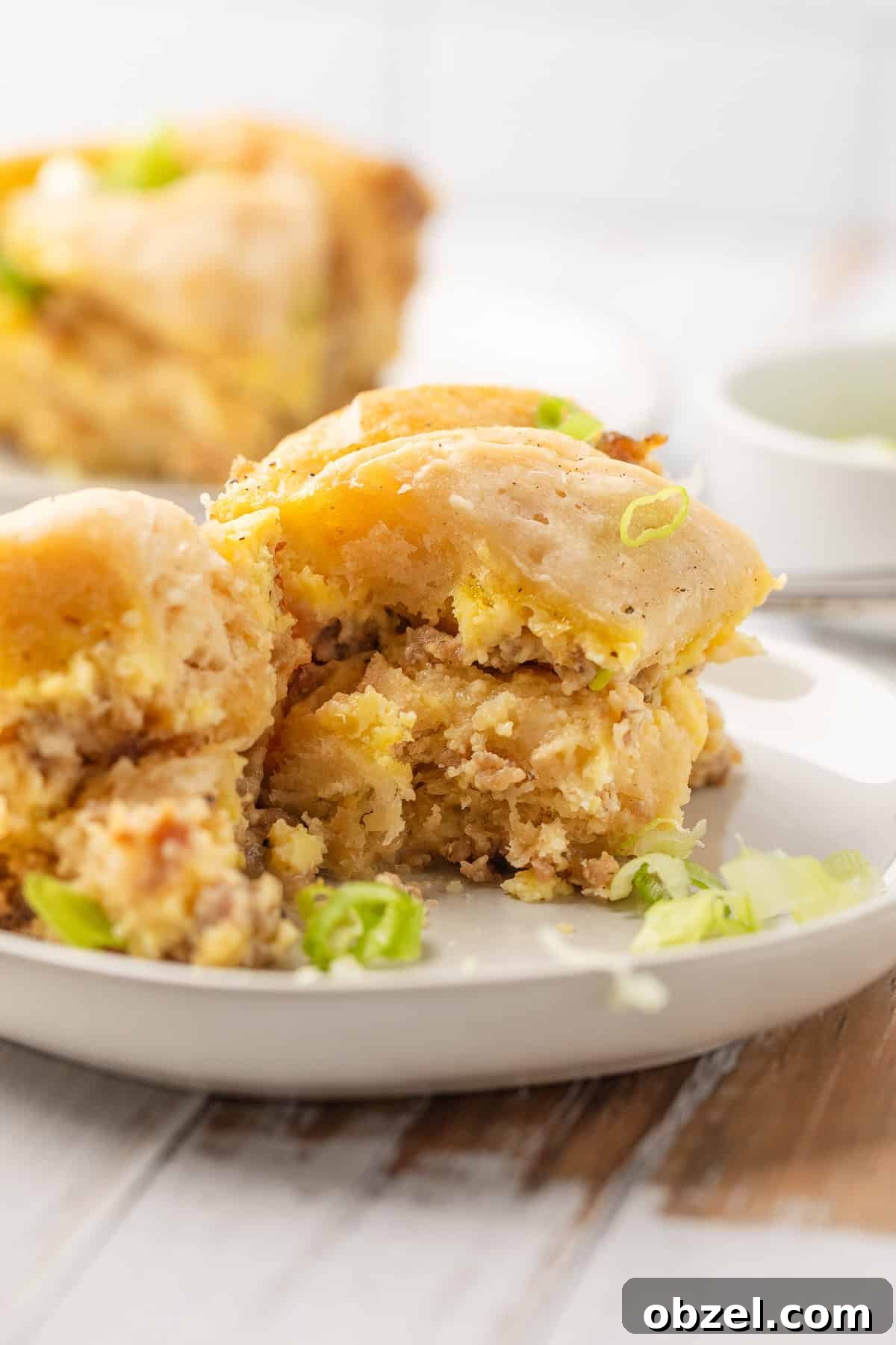 Slow Cooker Biscuits and Sausage Gravy Casserole 12 Crockpot biscuits and gravy casserole on a plate.