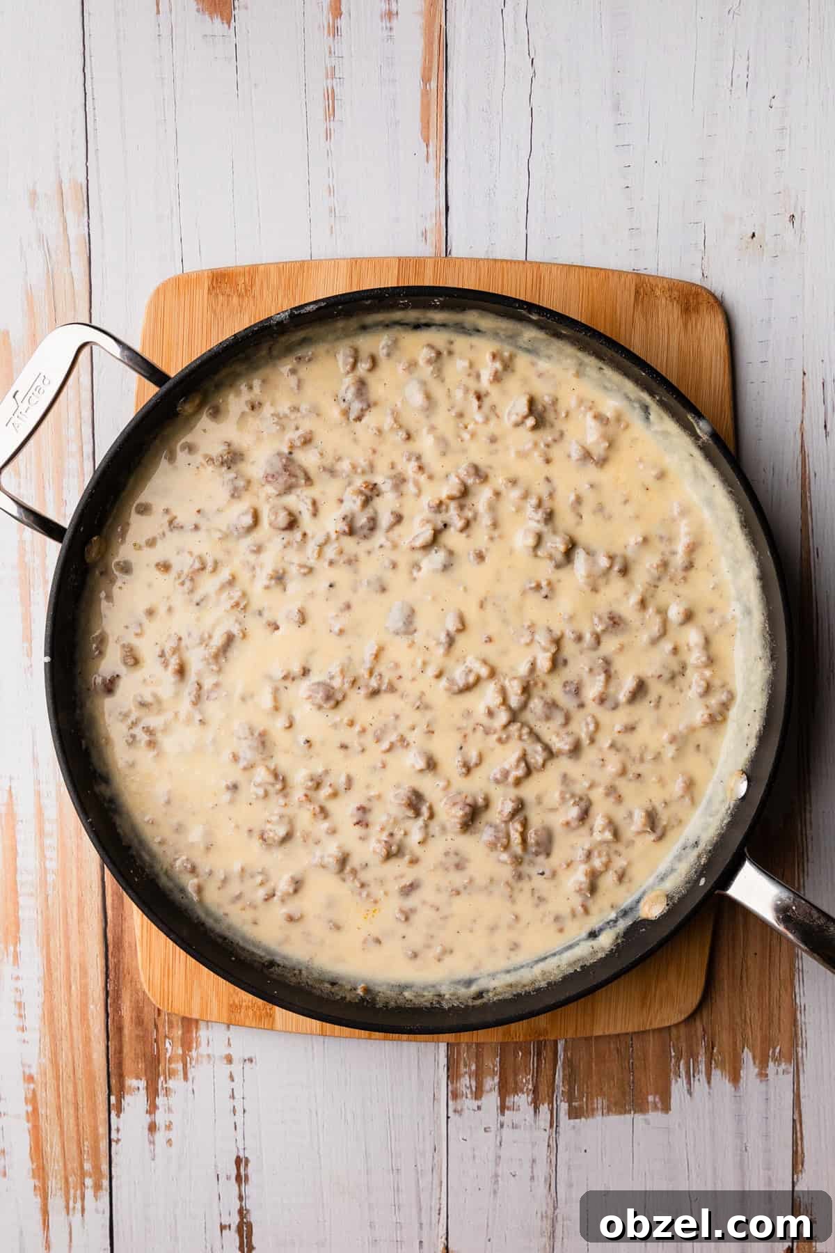 Slow Cooker Biscuits and Sausage Gravy Casserole 4 A skillet of sausage gravy.