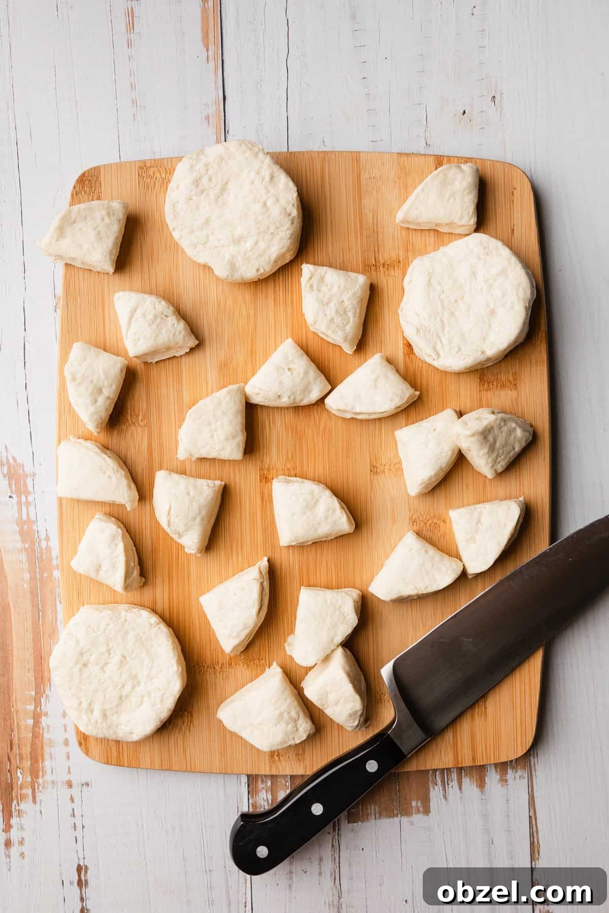 Slow Cooker Biscuits and Sausage Gravy Casserole 5 Cut up biscuits for the recipe.