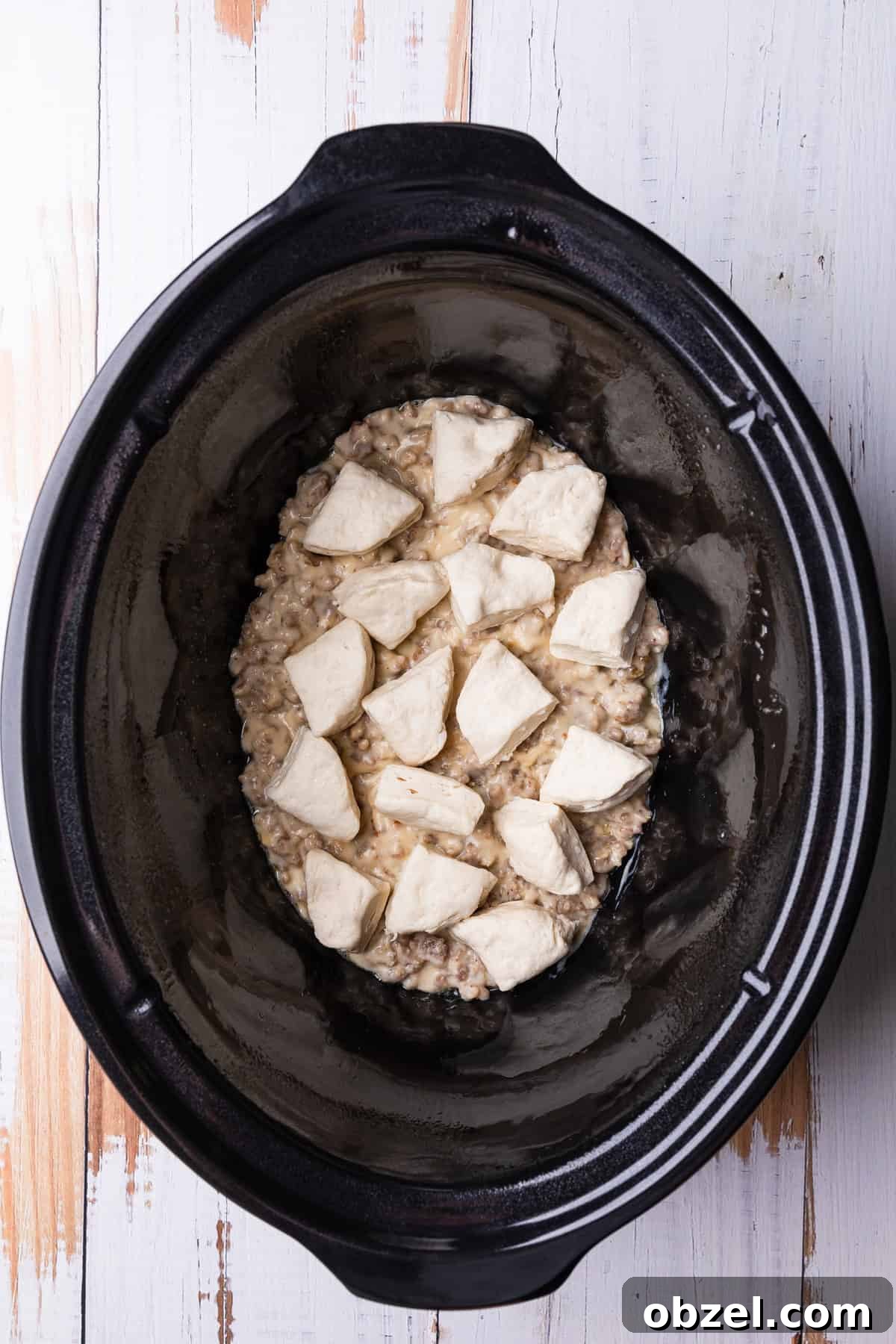 Slow Cooker Biscuits and Sausage Gravy Casserole 7 The biscuit layer.