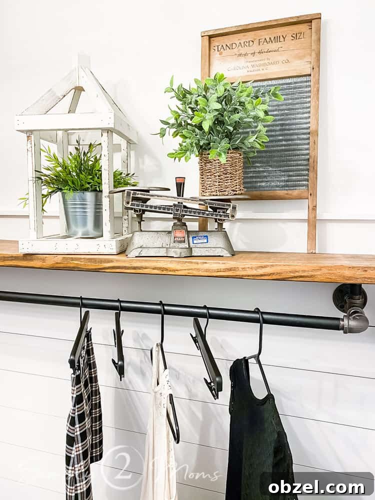Stunning Before and After Laundry Room Makeover 18 laundry room shelves decorated with faux plants vintage school scale and vintage wash board