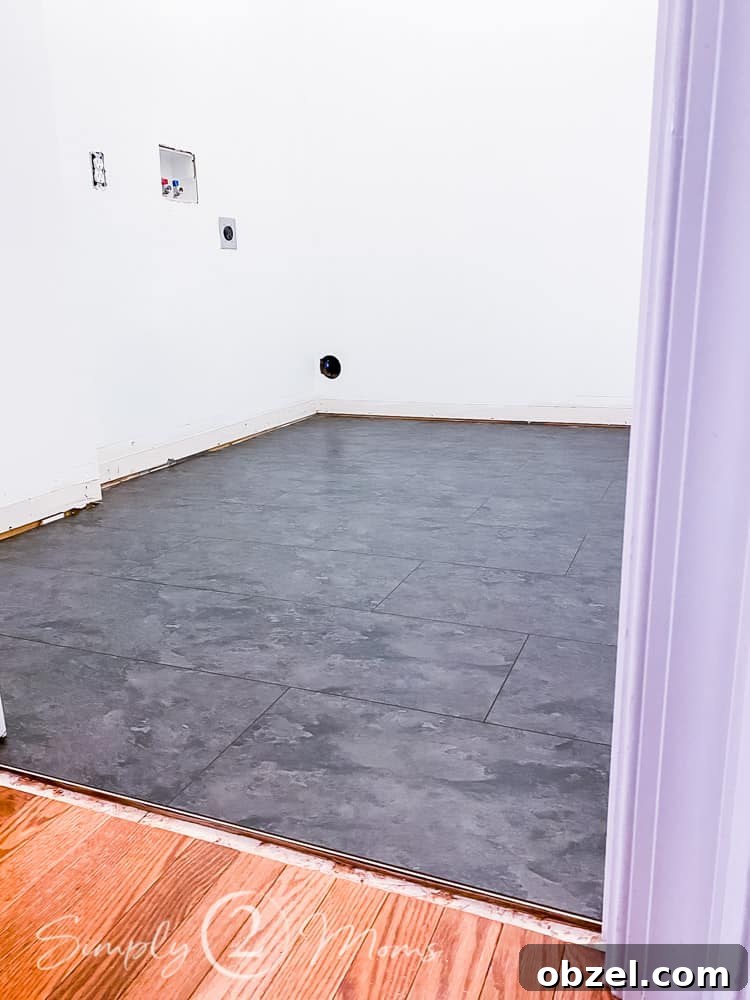 Stunning Before and After Laundry Room Makeover 27 laundry room with interlocking vinyl flooring installed in room