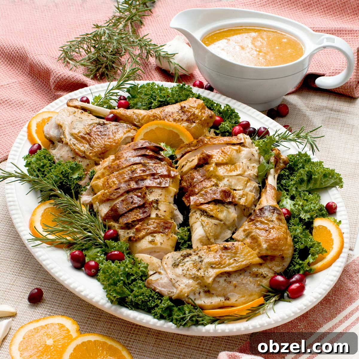 A crispy spatchcock turkey with gluten-free gravy on a serving platter.