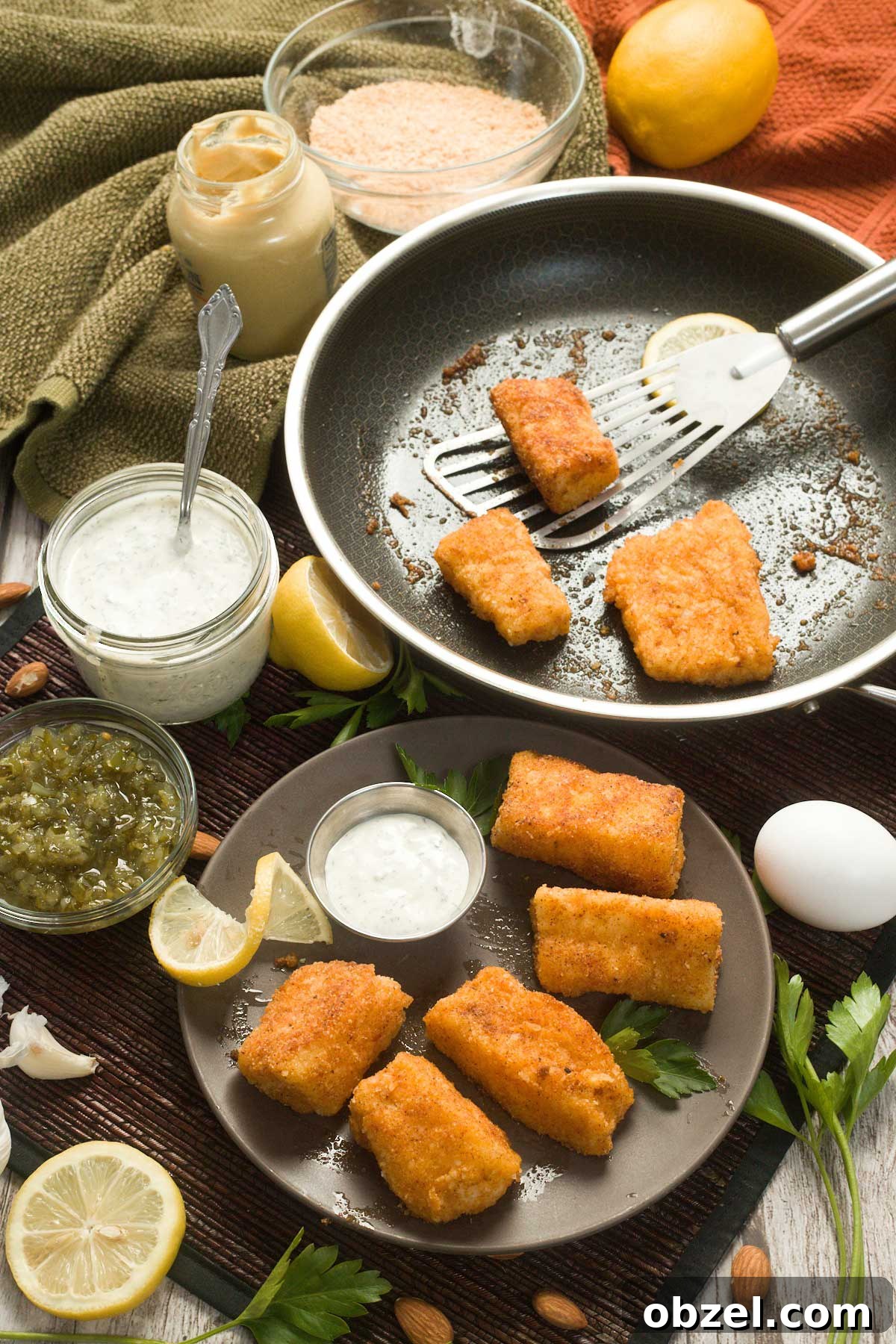 Gluten Free Breaded Fish with Homemade Tartar Sauce 4 Pan-fried cod on a plate with greek yogurt tartar sauce.