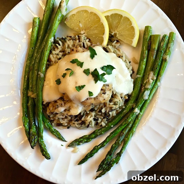 Plated Slow Cooker Lemon Garlic Chicken with asparagus