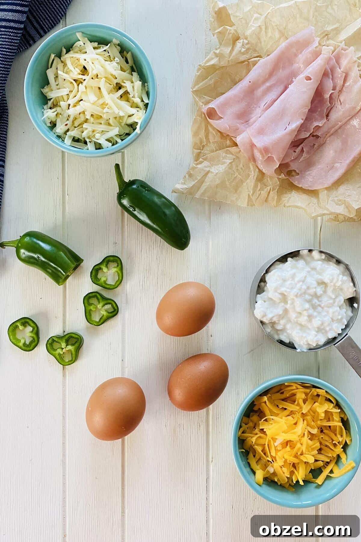 Spicy Jalapeno Popper Egg Cups Recipe 3 eggs, jalapeno, ham, cheese.