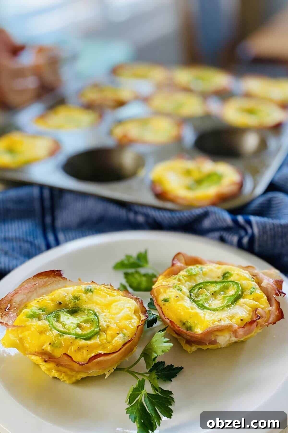 Spicy Jalapeno Popper Egg Cups Recipe 10 2 jalapeno egg cups on a plate.