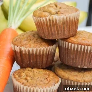 stack of banana carrot muffins with a carrot on the side and bananas in the background