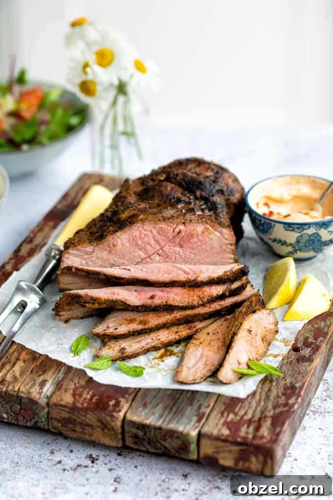 Marinated BBQ Boneless Leg of Lamb Recipe 11 Cooked butterflied leg of lamb served on a board