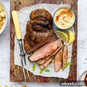 Marinated BBQ Boneless Leg of Lamb Recipe 13 Grilled butterflied lamb on a wooden board partially sliced